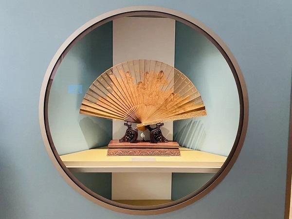 Hand-painted Chinese folding fan with floral motifs